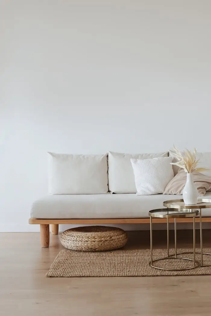 White Couch on Wooden Floor